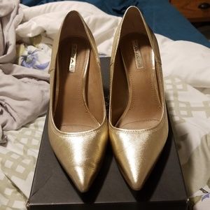 Tahari gold pumps.